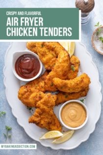 Overhead view of air fryer chicken tenders arranged on a white platter amongst bowls of dipping sauces. Text overlay includes recipe name.