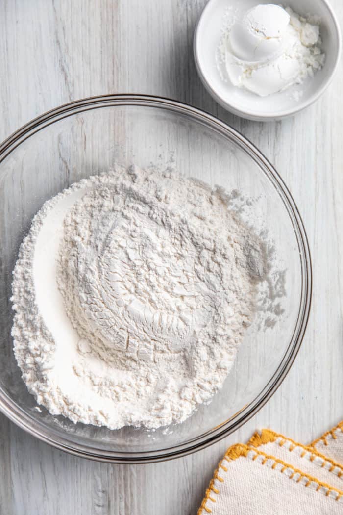 Bowl of all-purpose flour next to a small bowl of cornstarch.