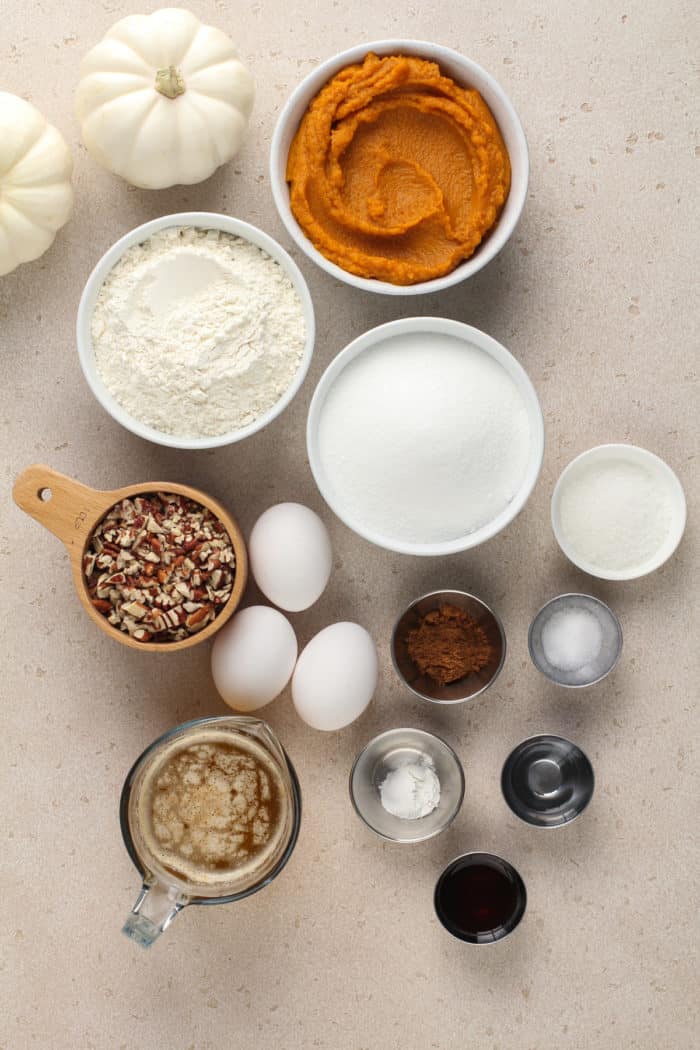 Ingredients for brown butter pumpkin bread arranged on a countertop.