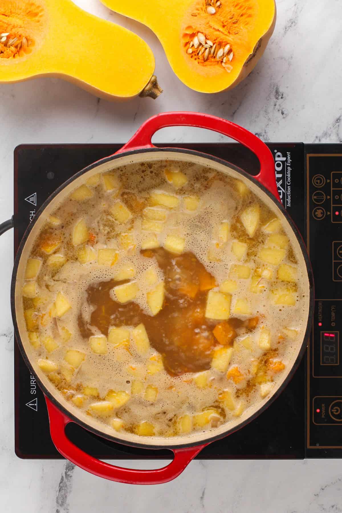 butternut squash soup cooking on the stove