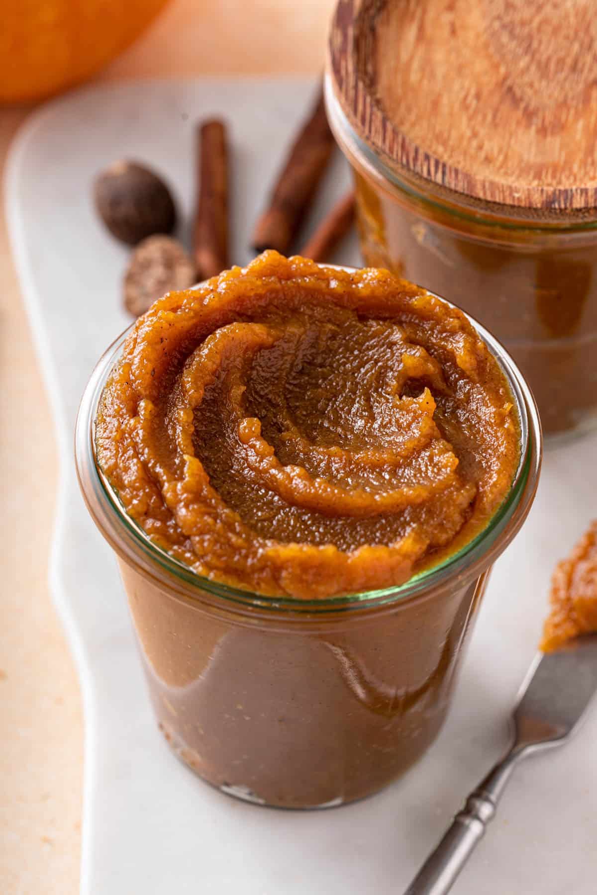 a glass jar of pumpkin butter