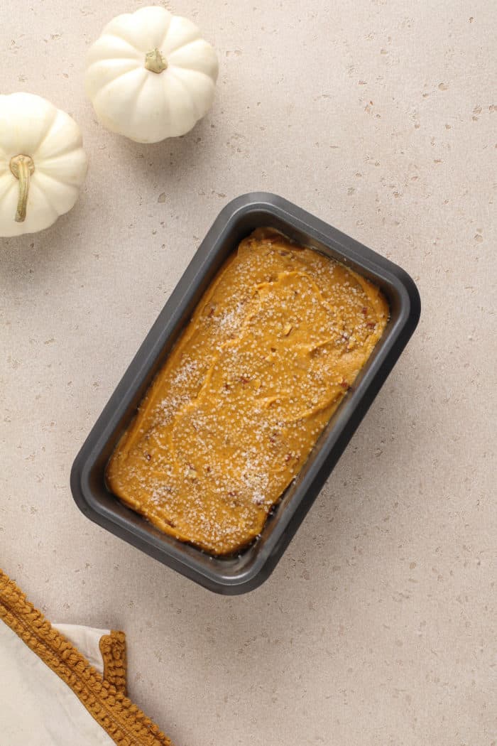 Unbaked brown butter pumpkin bread batter in a loaf pan, ready to go in the oven.