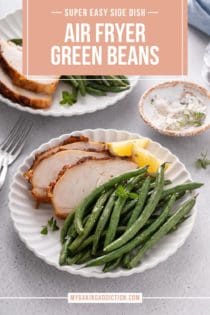 Air fryer green beans next to slices of roasted chicken and wedges of lemon on a white plate. Text overlay includes recipe name.