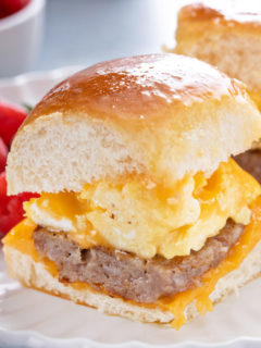 Close up of breakfast slider on a white plate.