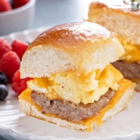 Close up of breakfast slider on a white plate.