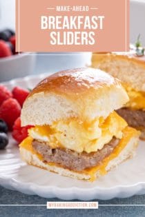 Close up of a breakfast slider on a white plate in front of fresh mixed berries. Text overlay includes recipe name.