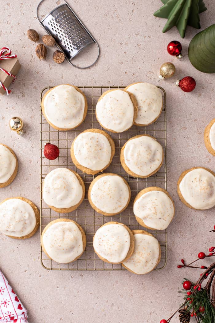 Overhead view of iced eggnog cookies on a wire cooling rack.