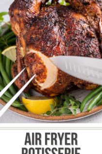Knife and carving fork slicing a piece of chicken breast from a roasted air fryer chicken. Text overlay includes recipe name.