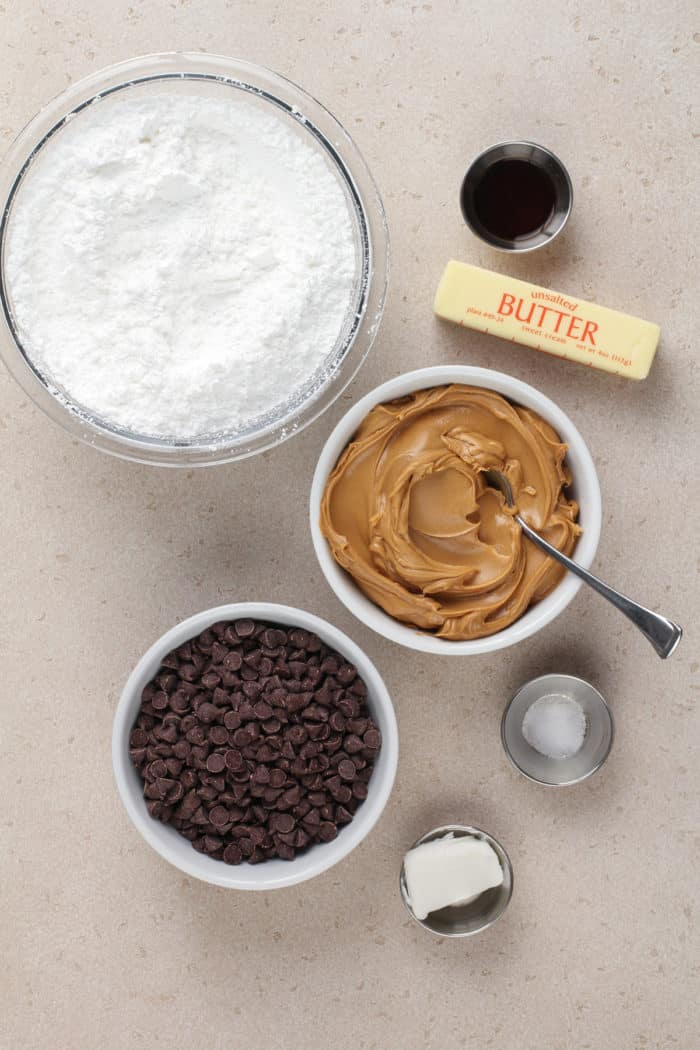 Ingredients for buckeyes arranged on a beige countertop.