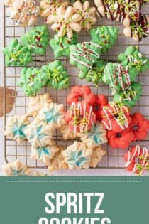 Overhead view of assorted spritz cookies on a wire cooling rack. Text overlay includes recipe name.