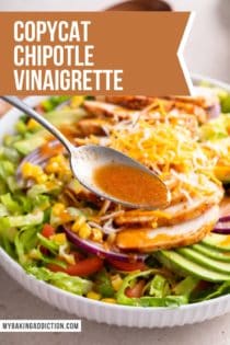 Close up of a spoon adding chipotle vinaigrette over the top of a salad. Text overlay includes recipe name.