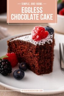 Slice of eggless chocolate cake with several bites taken from it on a white plate. Text overlay includes recipe name.