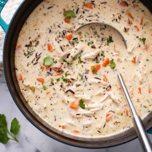 Overhead view of chicken and wild rice soup in a large dutch oven.