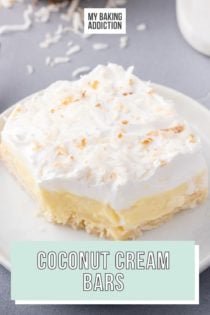 Coconut cream bar on a white plate. A bite has been taken from the corner of the bar. Text overlay includes recipe name.