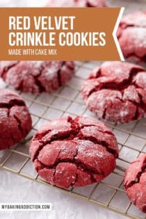 Close up of red velvet crinkle cookies on a wire cooling rack. Text overlay includes recipe name.
