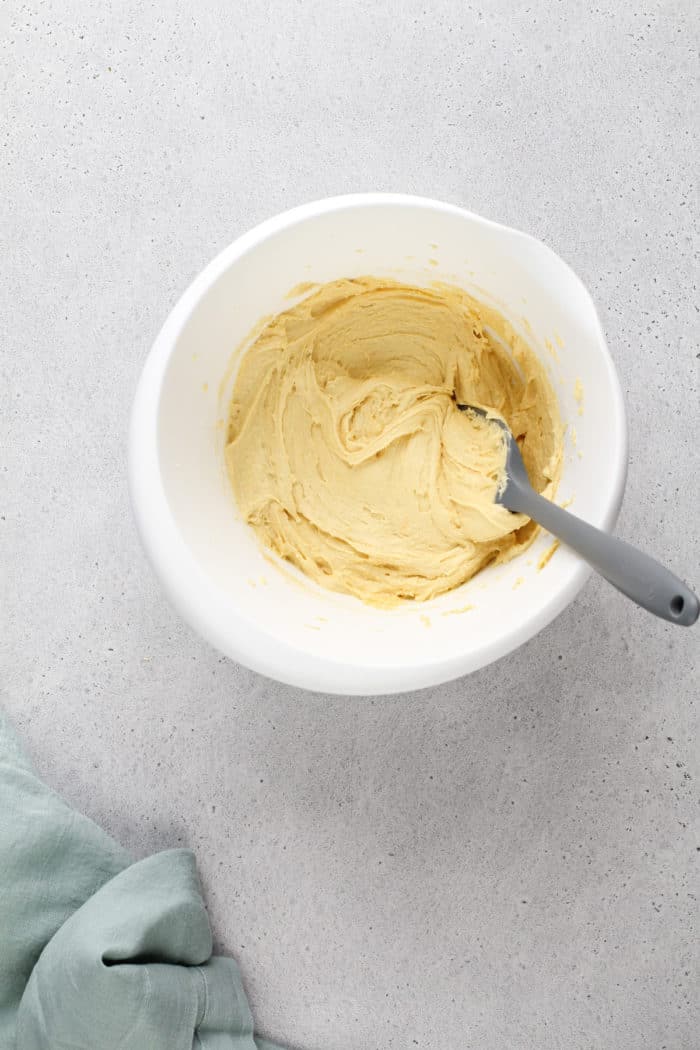 Gooey butter cake base batter in a white mixing bowl.