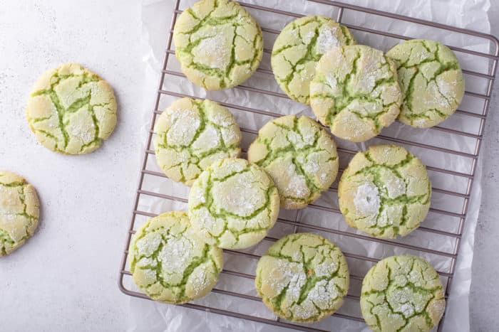 Overhead view of st. patrick's day crinkle cookies cooling on a wire rack.