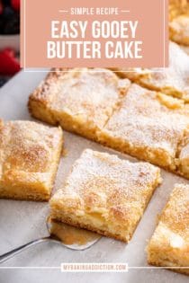 Sliced gooey butter cake, with a cake server about to lift up a slice of the cake. Text overlay includes recipe name.