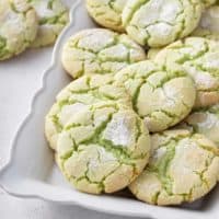 St. Patricks Day crinkle cookies on a white platter.