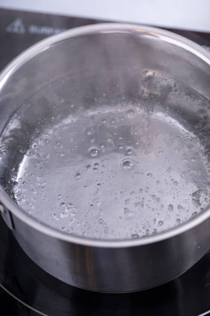 Simmering water in a sauce pot.