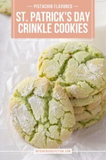 Several stacked green crinkle cookies next to a glass of milk. One of the cookies is leaning against the stack. Text overlay includes recipe name.