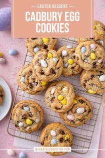 Cadbury egg cookies scattered on a wire cooling rack on top of a piece of parchment paper. Text overlay includes recipe name.