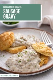 Close up of biscuits topped with sausage gravy on a white and brown plate. Text overlay includes recipe name.