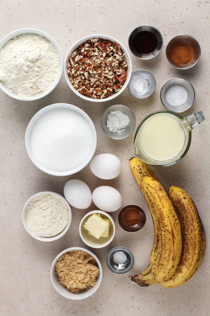 Banana nut bread ingredients arranged on a countertop.