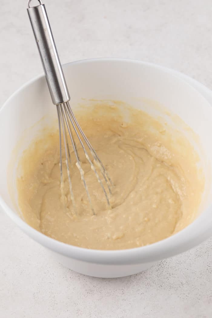 Buttermilk pancake batter in a white mixing bowl.