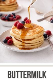 Syrup being poured over a stack of buttermilk pancakes on a white plate. Text overlay includes recipe name.