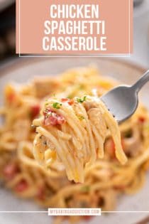 Fork holding up a bite of chicken spaghetti casserole. Text overlay includes recipe name.