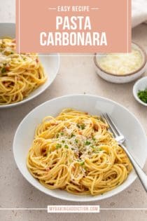 White bowl filled with pasta carbonara. Another bowl of the pasta and a small bowl of parmesan cheese are both visible in the background. Text overlay includes recipe name.