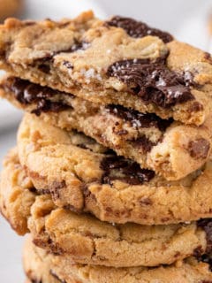 Stacked chocolate chip cookies with toffee and brown butter.