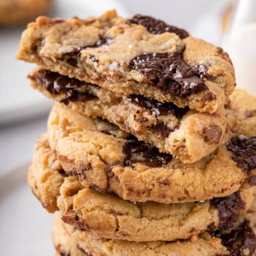 Stacked chocolate chip cookies with toffee and brown butter.