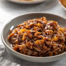 Bowl filled with caramelized onions.