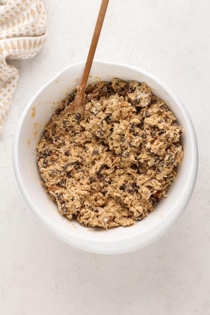 Cowboy cookie dough in a large white mixing bowl.