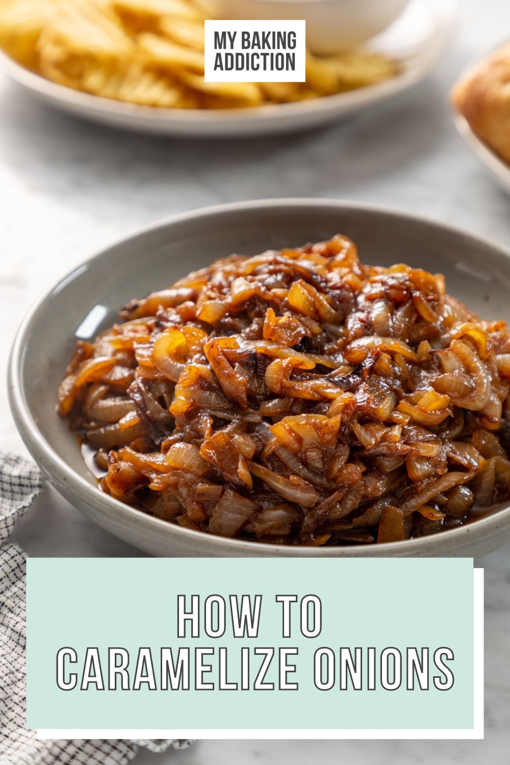 Gray bowl filled with caramelized onions, set on a marble countertop. Text overlay includes recipe name.