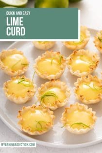 White platter filled with mini phyllo tart shells that are filled with lime curd and topped with lime zest. text overlay includes recipe name.