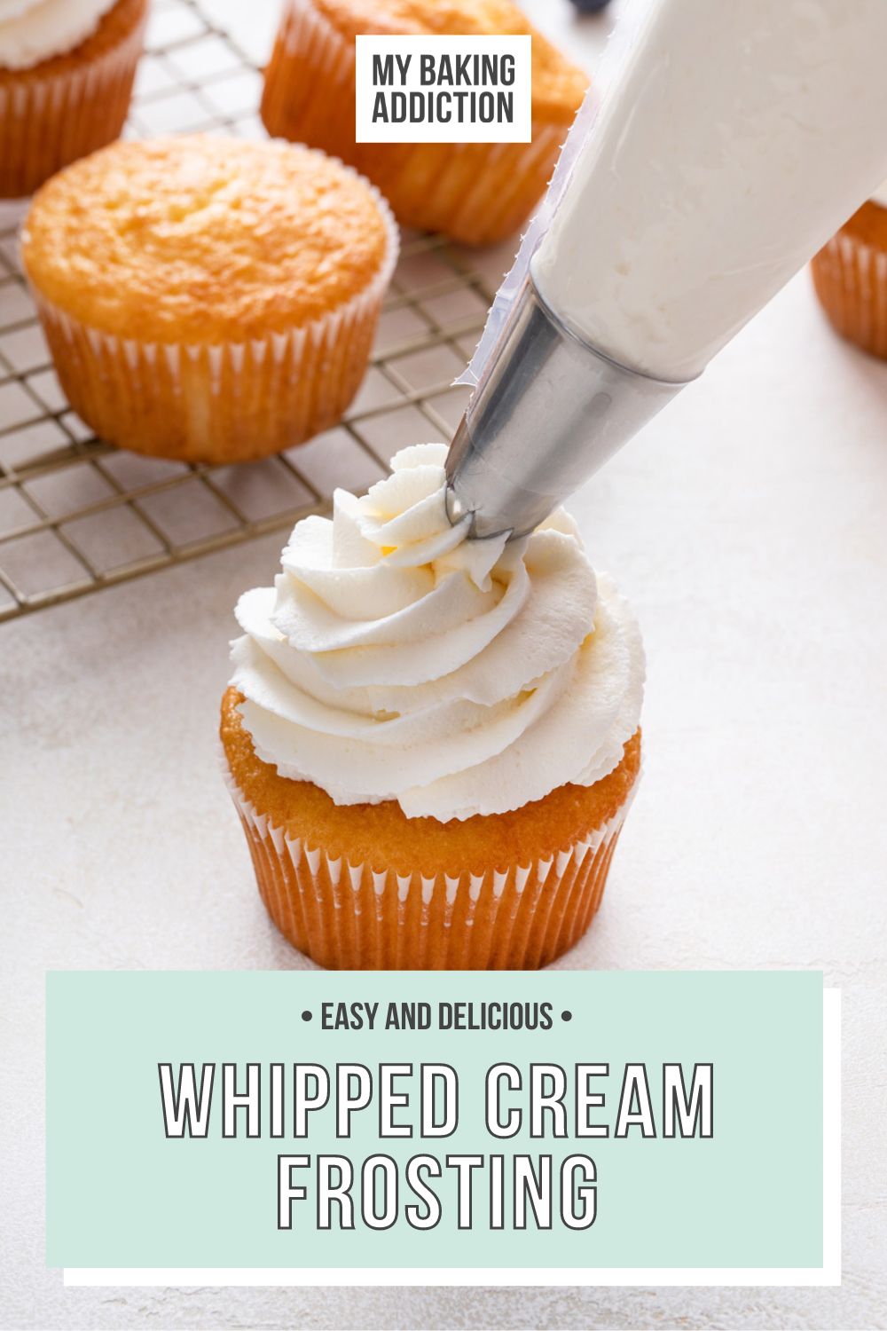 Close up of a vanilla cupcake topped with whipped cream frosting. Text overlay includes recipe name.
