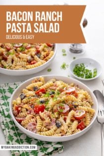 Two white bowls filled with bacon ranch pasta salad, set on a white countertop with a green and white napkin. Text overlay includes recipe name.