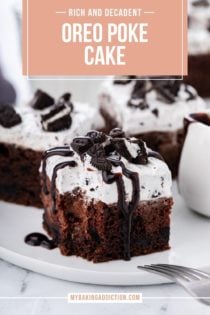Slice of oreo poke cake drizzled with chocolate sauce, with a bite taken from the corner of the cake. Text overlay includes recipe name.