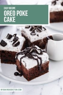 Three slices of oreo poke cake on a white plate. One of the slices is drizzled with hot fudge sauce. Text overlay includes recipe name.