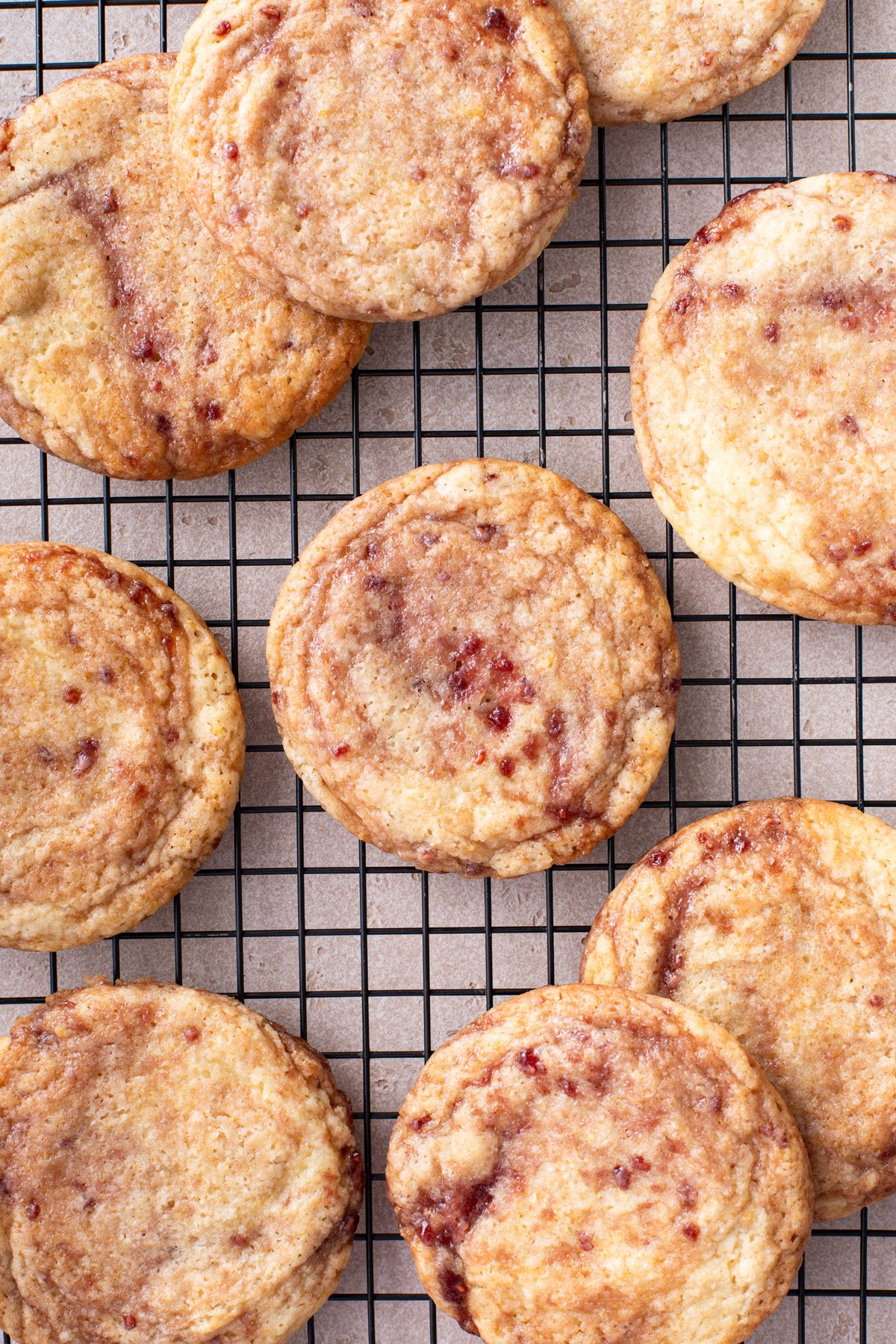 Close up of raspberry lemon cookies cooling on a wire rack.