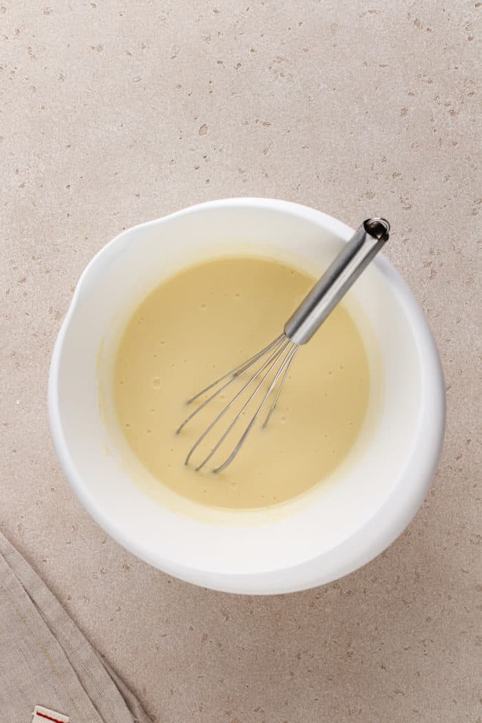 Cheesecake pudding mixed in a white mixing bowl.