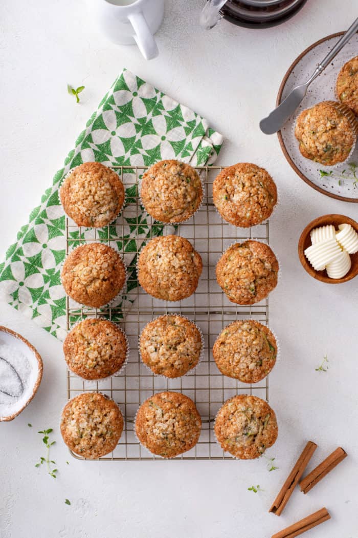 Overhead image of zucchini muffins lined up on a wire cooling rack.