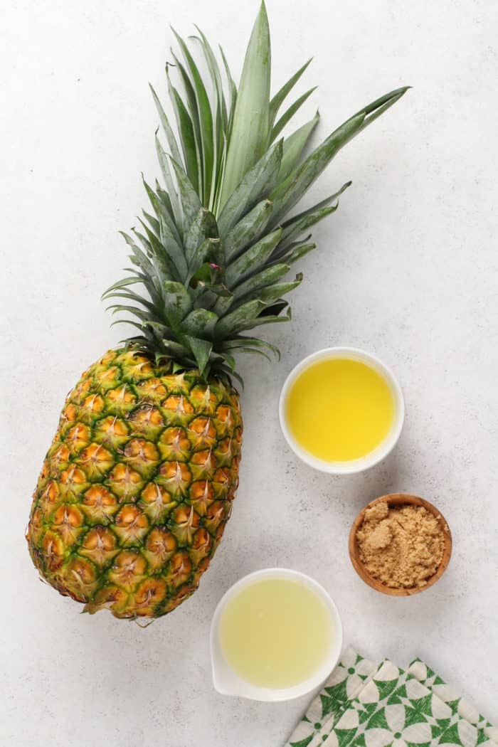 Grilled pineapple ingredients arranged on a light countertop.