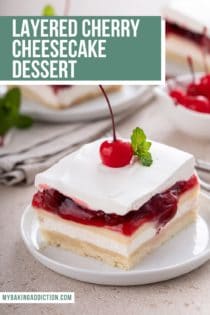 White plate with a slice of layered cherry cheesecake dessert topped with a maraschino cherry and sprig of mint. Text overlay includes recipe name.