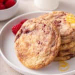 Stack of raspberry lemon cookies on a white plate.