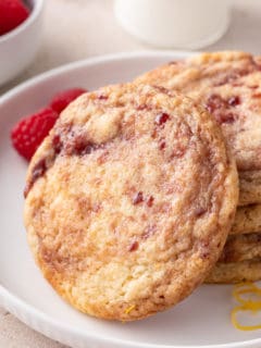 Stack of raspberry lemon cookies on a white plate.