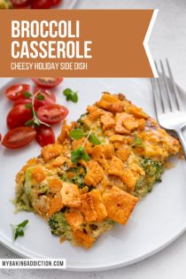 Broccoli casserole next to a fork and a tomato salad on a white plate. Text overlay includes recipe name.